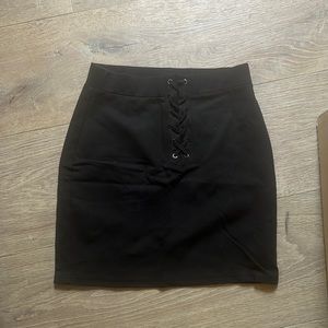 forever 21 size small. body con skirt with ties in the front